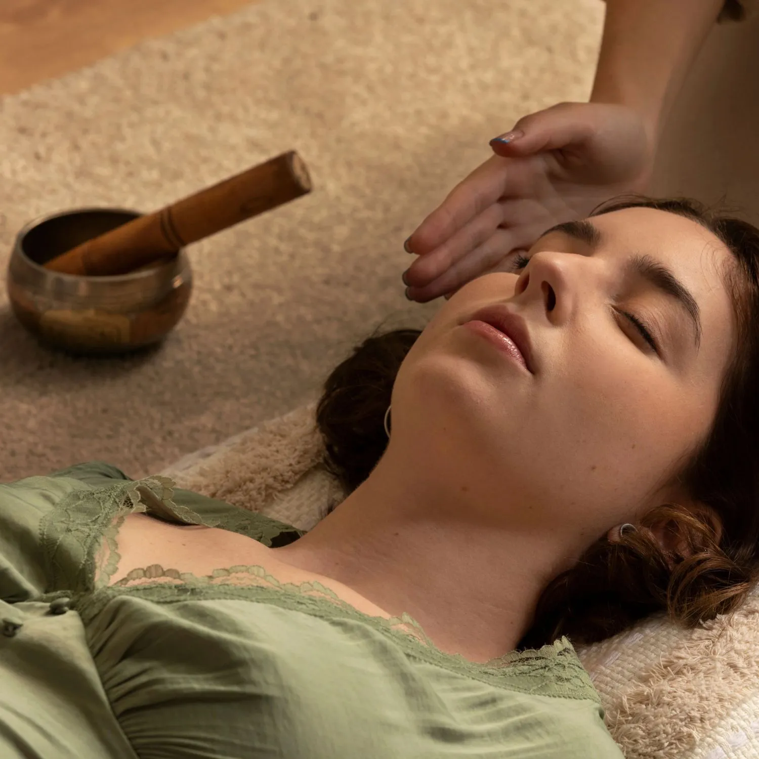 Daily Sound Healing Therapy at Retreat Inn Kerala ayurveda yoga resort Guest experiencing a daily sound healing session at Retreat Inn Kerala, using a Tibetan singing bowl to promote relaxation, balance, and holistic well-being.